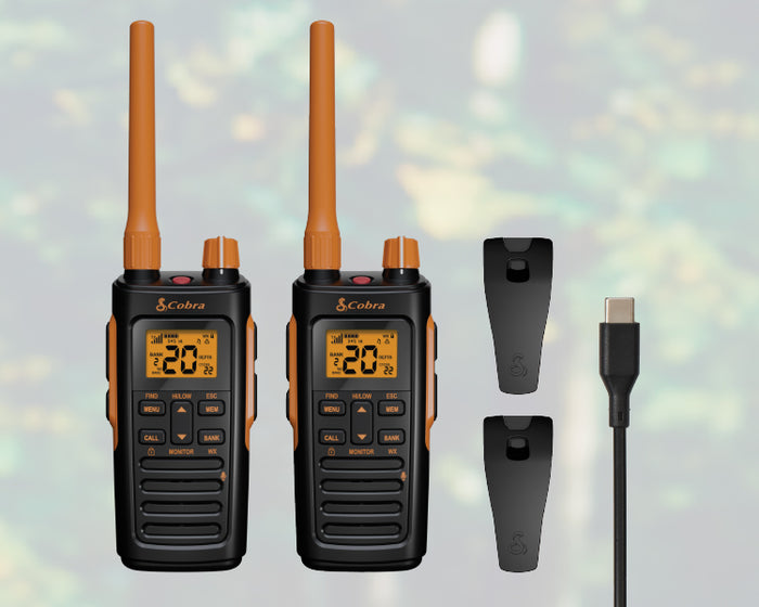 Contents of Cobra Trailblazer 450 GMRS radio retail box include 2 radios with included li-ion batteries, belt clips, and charge cable